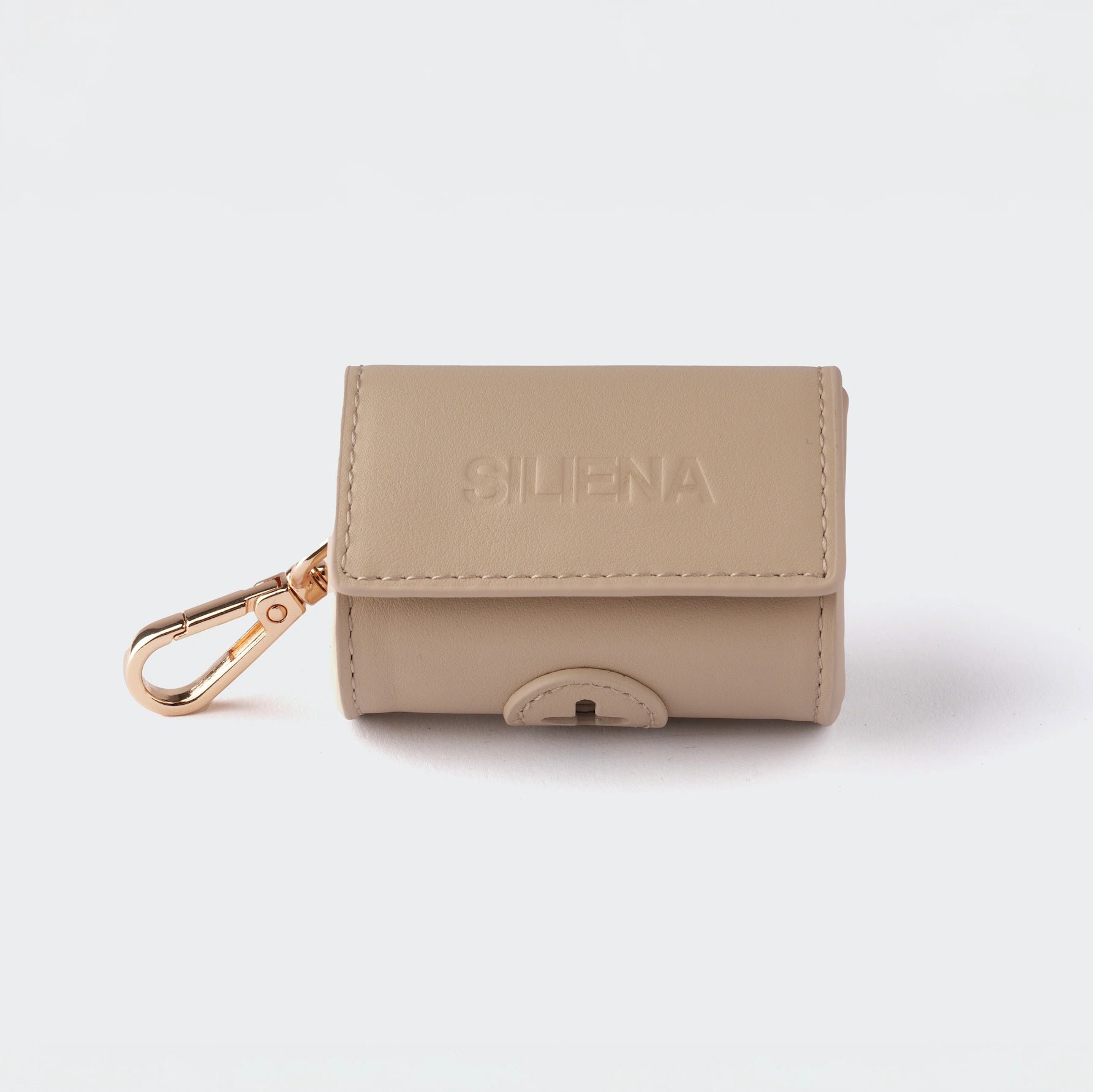 Kotbeutelspender aus echtem Rindsleder in Beige mit geprägtem SILENA Logo und goldfarbenem Clip.